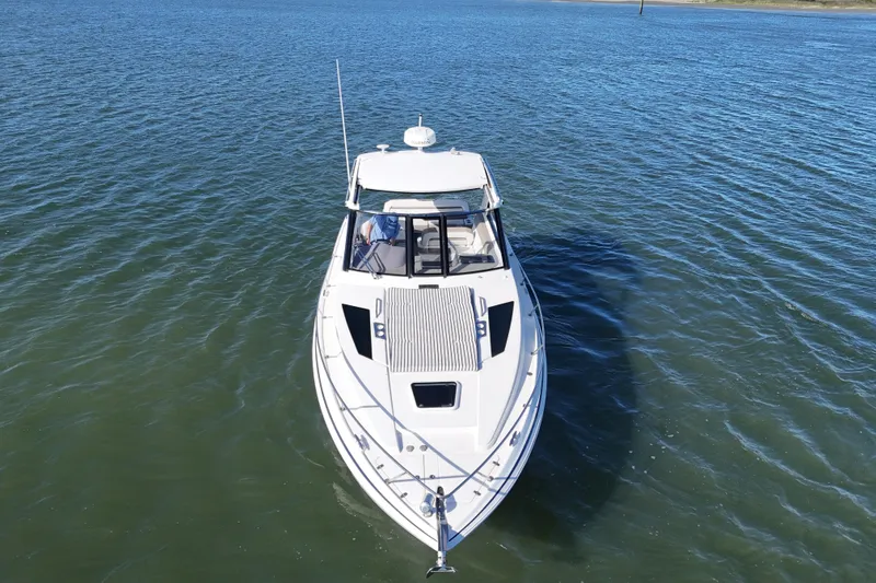 Slide: The Image of 2016 Regal 35 Sport Coupe cruising on open water, aerial view. - 23