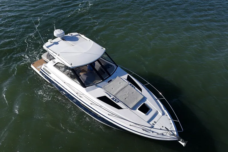 Slide: The Image of 2016 Regal 35 Sport Coupe cruising on open water, aerial view. - 24
