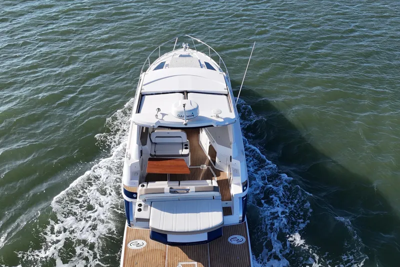 Slide: The Image of Overhead view of a 2016 Regal 35 Sport Coupe cruising on open water. - 26