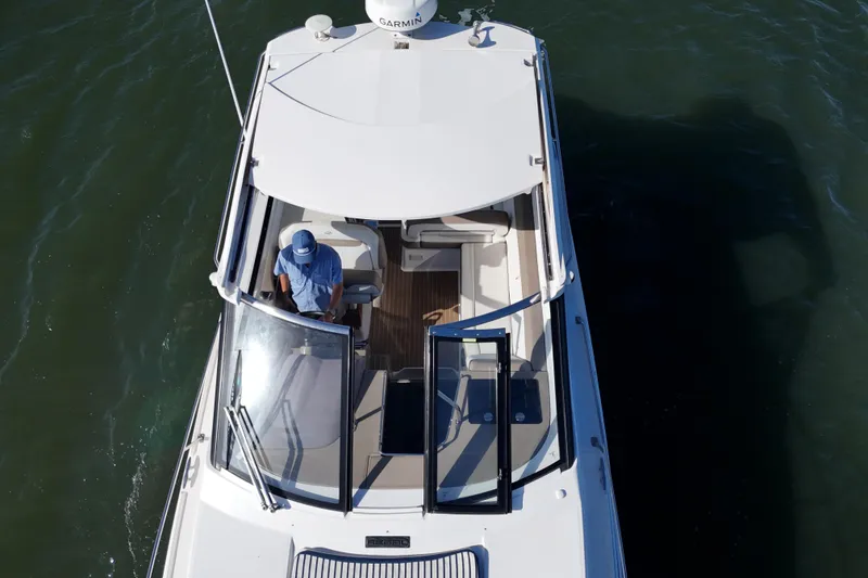 Slide: The Image of Overhead view of a 2016 Regal 35 Sport Coupe boat on water. - 28