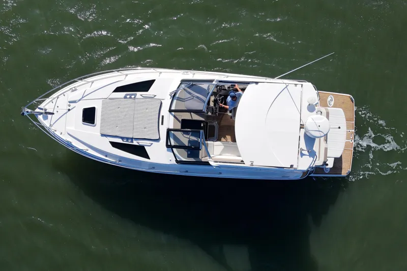 Slide: The Image of Overhead view of a 2016 Regal 35 Sport Coupe cruising on water. - 29