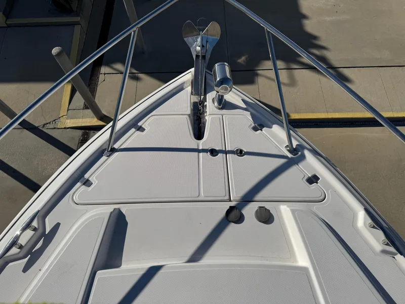 Slide: The Image of Bow of a 2016 Regal 35 Sport Coupe boat with anchor and railing. - 38