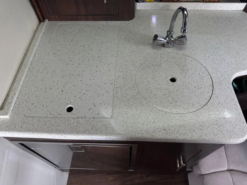 Slide: The Image of 2016 Regal 35 Sport Coupe kitchen countertop with integrated sink and faucet. - 43