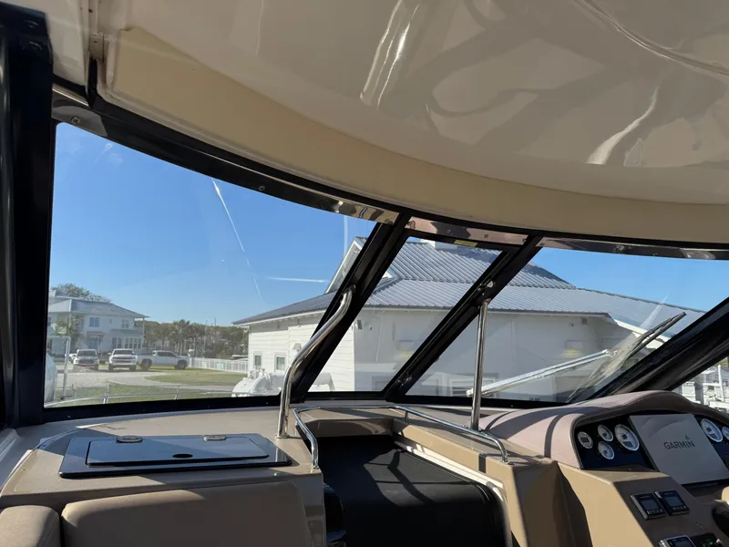 Slide: The Image of Interior view of 2016 Regal 35 Sport Coupe boat cockpit with dashboard and windows. - 44