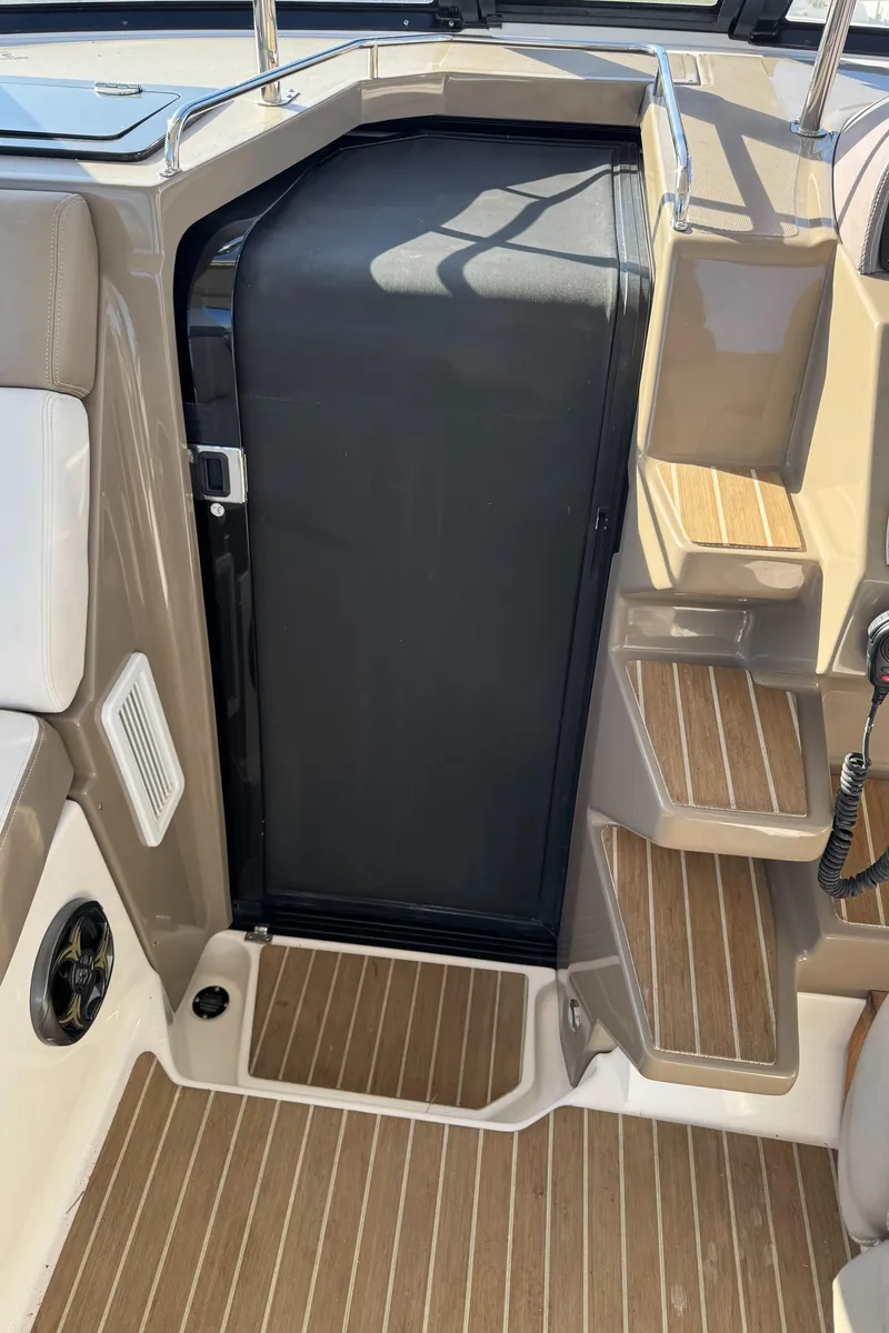 Slide: The Image of 2016 Regal 35 Sport Coupe interior with wooden steps and sleek design. - 48