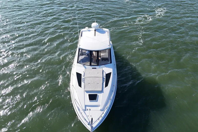 Slide: The Image of Aerial view of a 2016 Regal 35 Sport Coupe cruising on open water. - 71