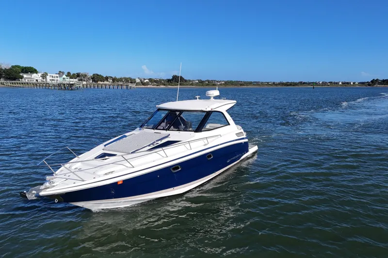 Slide: The Image of 2016 Regal 35 Sport Coupe cruising on a sunny day in open waters. - 87