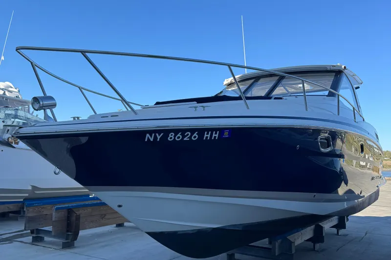 Slide: The Image of 2016 Regal 35 Sport Coupe boat on display, featuring sleek design and modern amenities. - 90