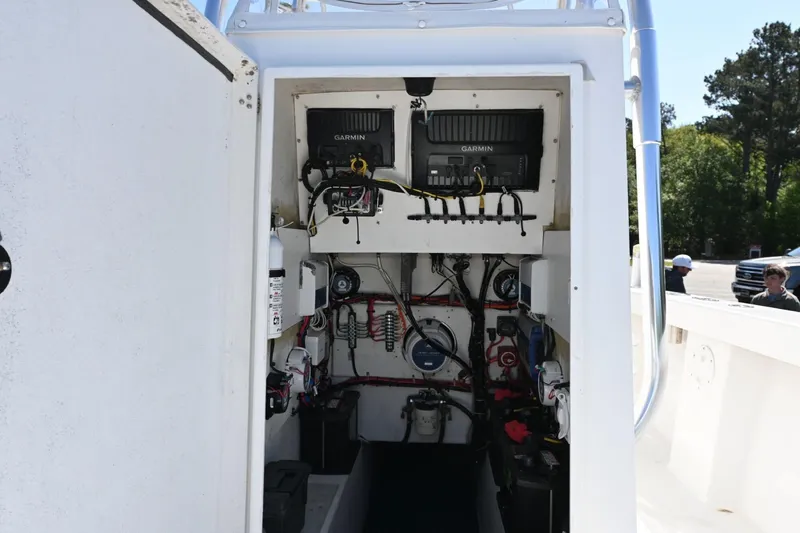 Slide: The Image of Interior view of a 2017 Rambo 27 boat's electronic and wiring setup. - 14