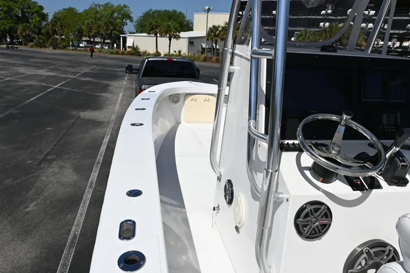 Slide: The Image of 2017 Rambo 27 boat on trailer, parked in lot with truck. - 7