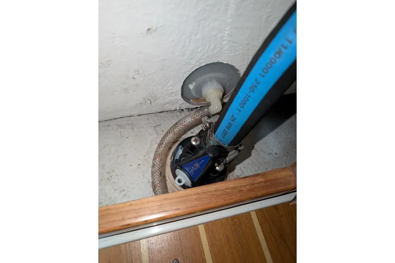 Slide: The Image of Close-up of Catalina 36 MkII 2007 boat plumbing with blue hose and fittings. - 44