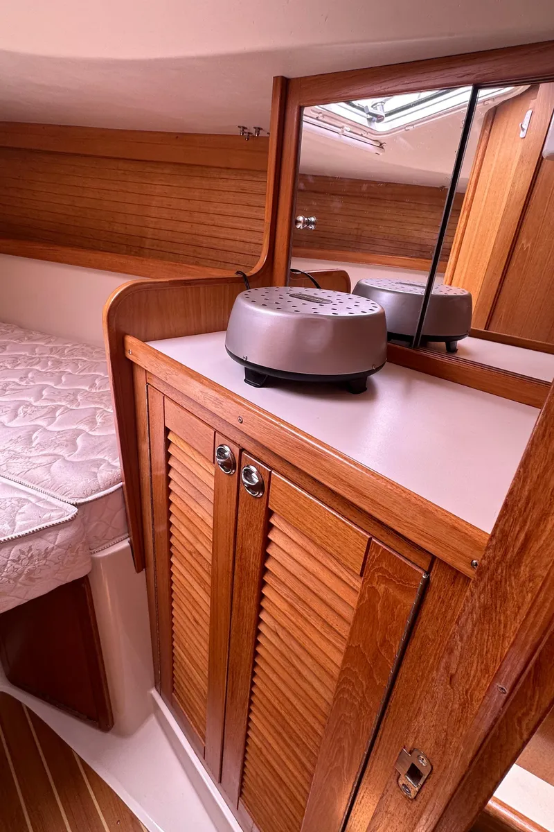 Slide: The Image of 2007 Catalina 36 MkII cabin interior with wooden cabinetry and bed. - 22