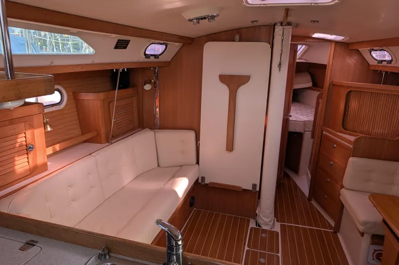 Slide: The Image of Interior of a 2007 Catalina 36 MkII sailboat with wood finish and cozy seating. - 15