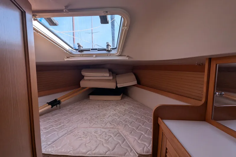 Slide: The Image of Interior cabin of 2007 Catalina 36 MkII sailboat with cozy bedding and wooden accents. - 20