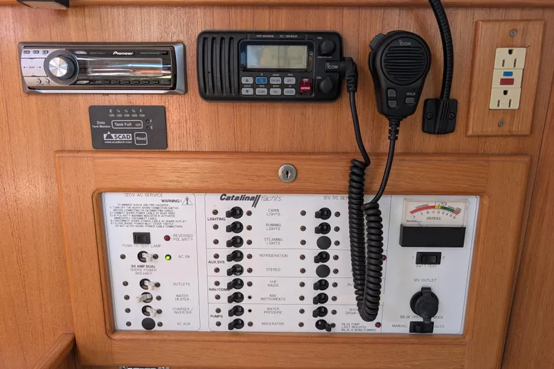 Slide: The Image of Control panel of a 2007 Catalina 36 MkII yacht with radio and electrical switches. - 36