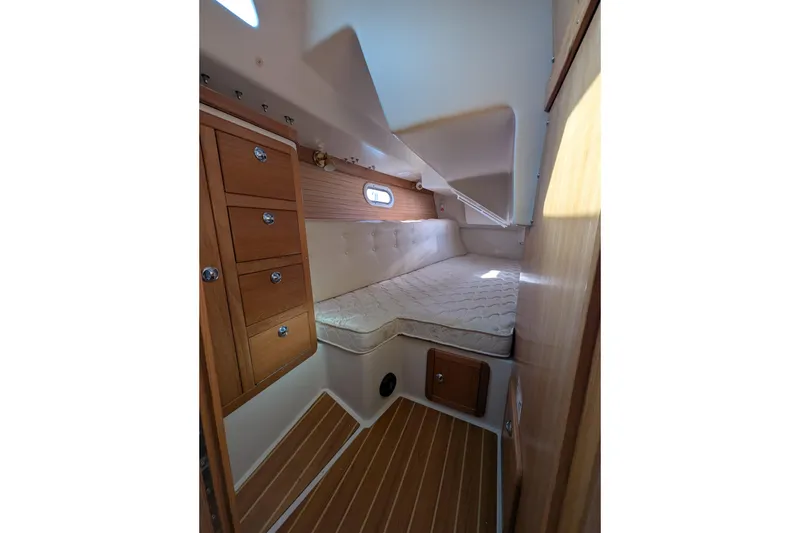 Slide: The Image of Interior cabin of 2007 Catalina 36 MkII sailboat with wooden cabinetry and bed. - 24