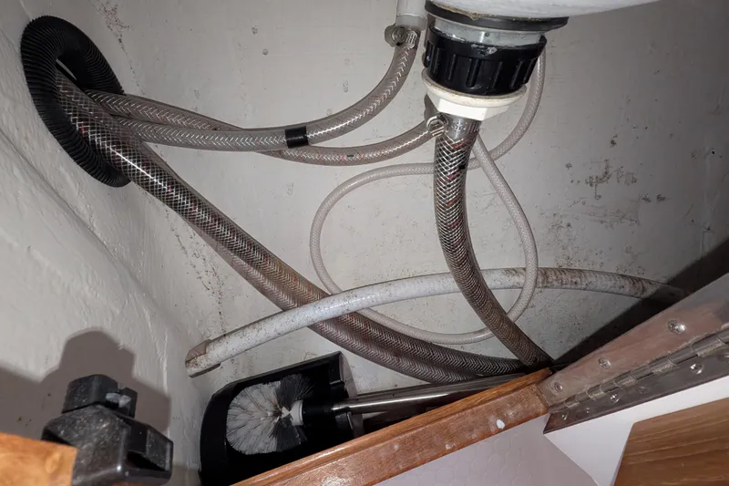 Slide: The Image of Plumbing hoses and brush in Catalina 36 MkII yacht, 2007 model. - 46