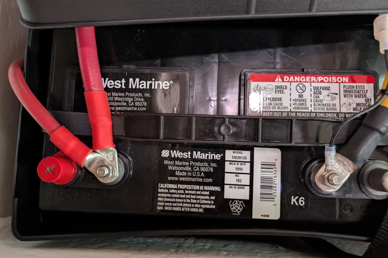Slide: The Image of Marine battery with red and black cables, West Marine branding, Catalina 36 MkII 2007. - 38