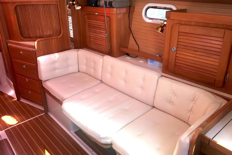 Slide: The Image of Luxurious interior of 2007 Catalina 36 MkII sailboat with plush seating and wooden cabinetry. - 14