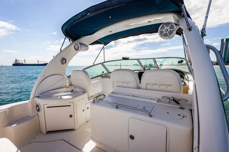 Slide: The Image of 2005 Sea Ray 340 Sundancer boat interior with ocean view and seating area. - 13
