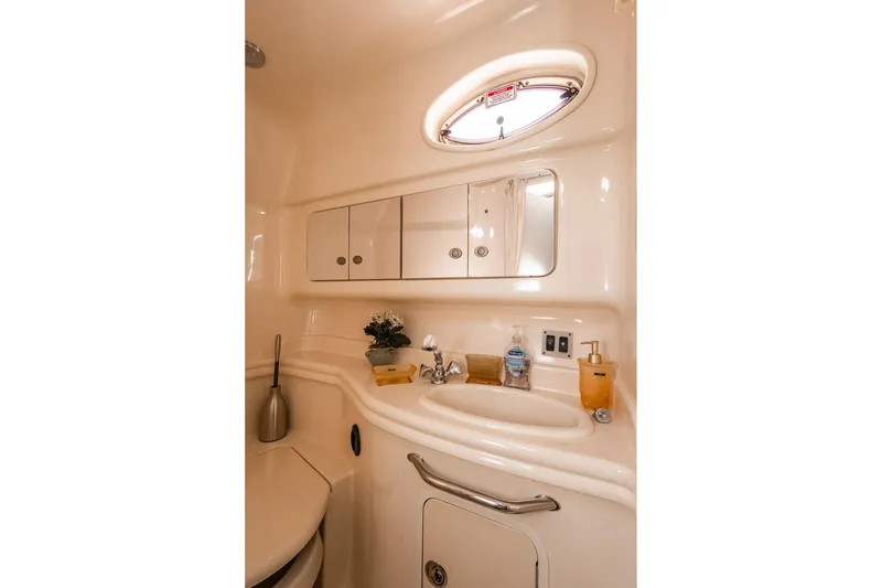 Slide: The Image of Luxurious bathroom interior of 2005 Sea Ray 340 Sundancer yacht with sink and mirror. - 16