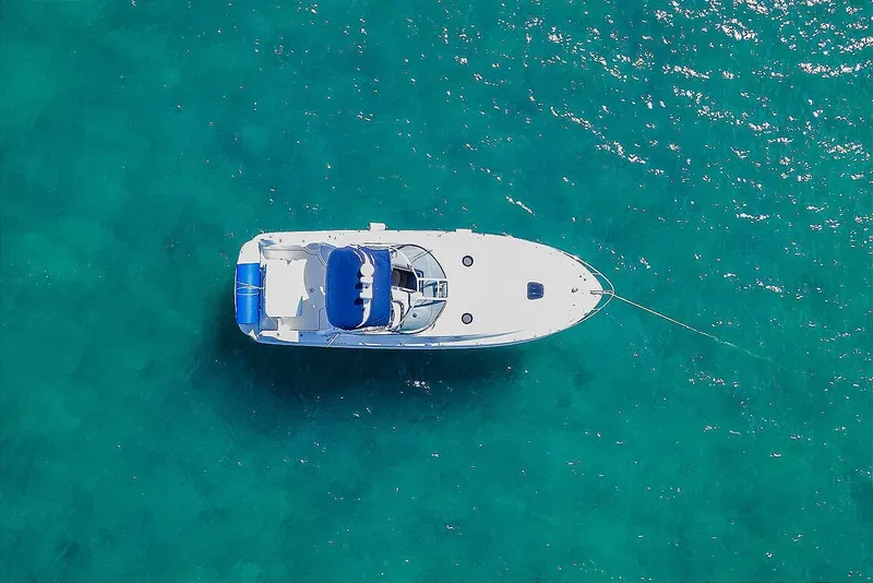 Slide: The Image of Aerial view of 2005 Sea Ray 340 Sundancer yacht on clear turquoise water. - 4