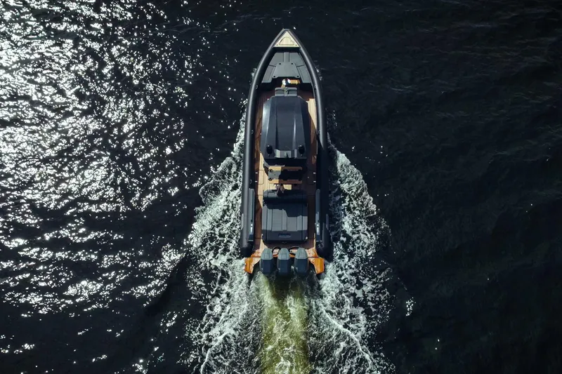 Slide: The Image of Aerial view of 2024 Skipper-BSK 42 boat cruising on dark water. - 12
