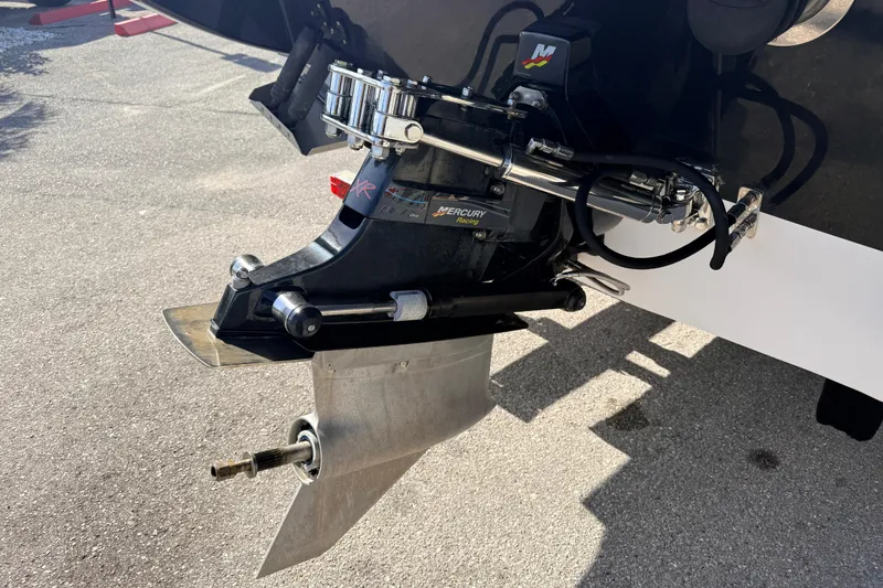 Slide: The Image of 2007 Donzi 27 ZR speedboat on trailer, black and white design, parked outdoors. - 10