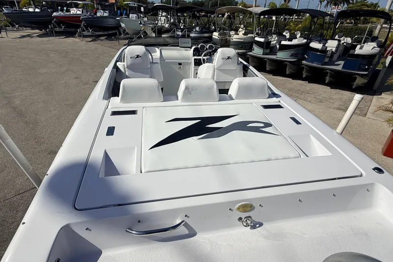 Slide: The Image of 2007 Donzi 27 ZR boat interior with white seating and modern dashboard controls. - 15