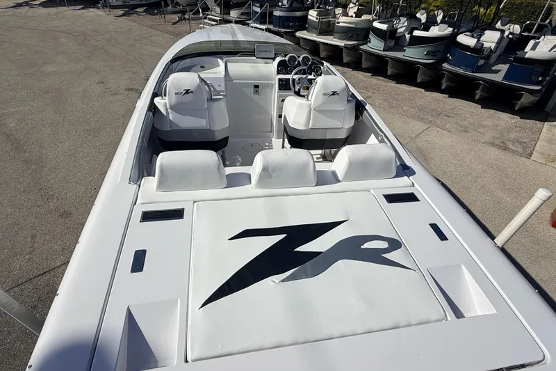 Slide: The Image of 2007 Donzi 27 ZR boat cockpit with Garmin navigation and sleek steering wheel. - 16