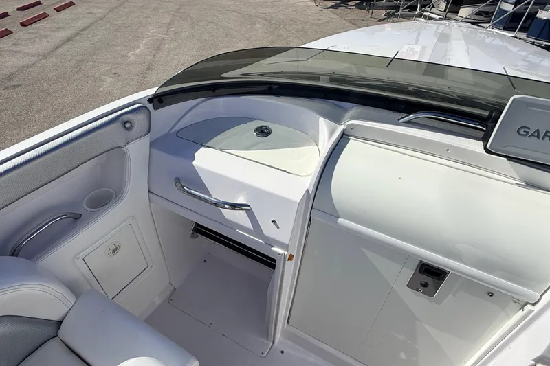 Slide: The Image of 2007 Donzi 27 ZR boat cockpit with white seating and steering wheel. - 20