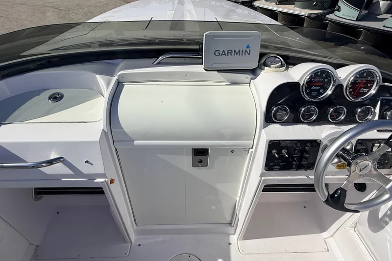 Slide: The Image of 2007 Donzi 27 ZR boat interior with white seating and sleek design. - 21