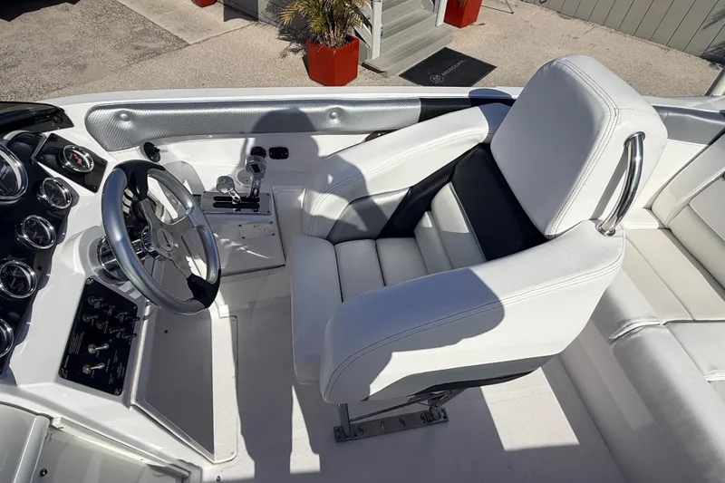 Slide: The Image of 2007 Donzi 27 ZR boat interior with white seating and stainless steel accents. - 22