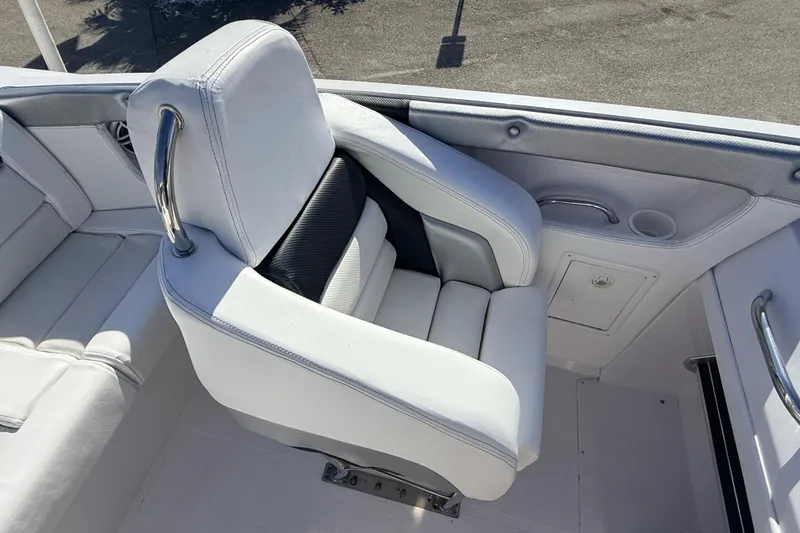 Slide: The Image of Interior of a 2007 Donzi 27 ZR boat with white seating and speaker. - 24