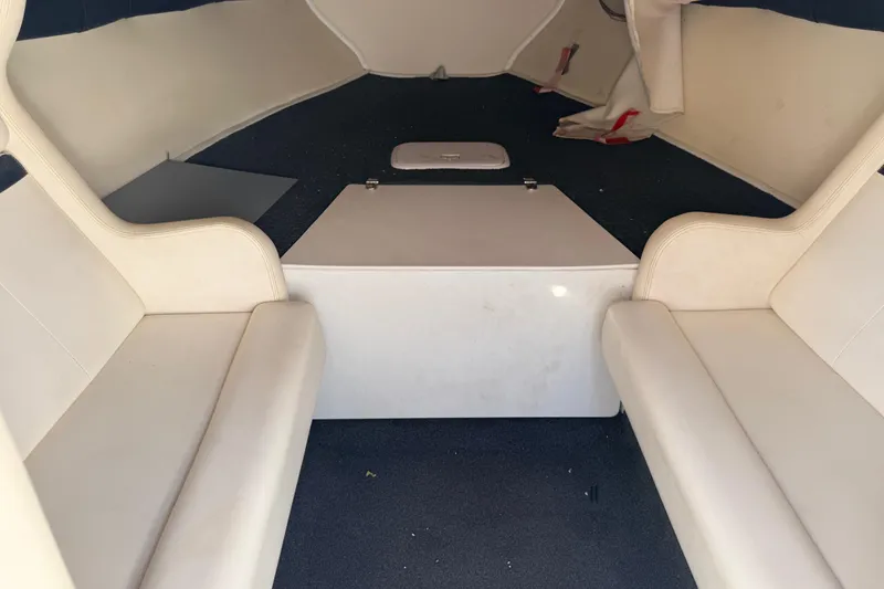 Slide: The Image of Cream-colored seating in a 2007 Donzi 27 ZR boat interior. - 30
