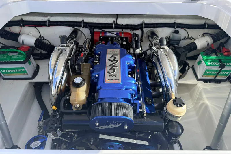 Slide: The Image of Engine compartment of a 2007 Donzi 27 ZR boat with a blue 525 EFI engine. - 34