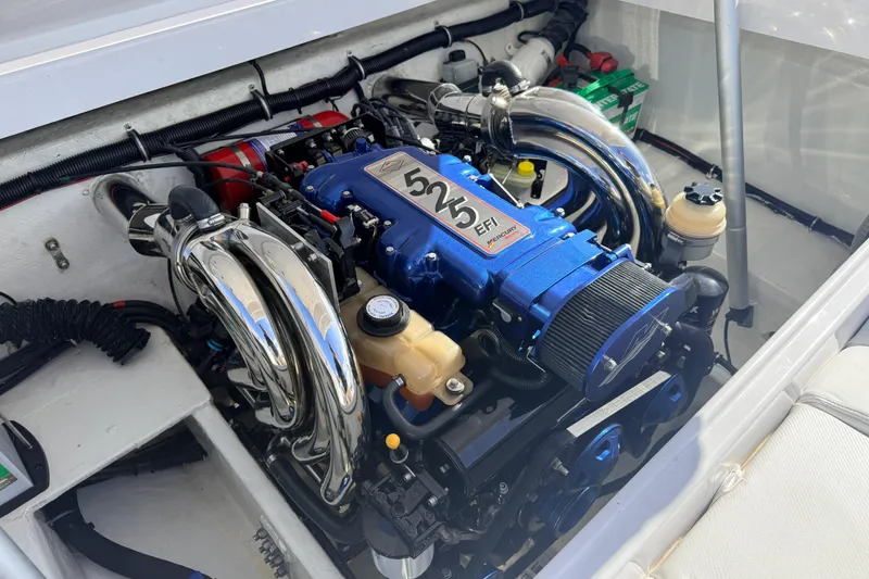 Slide: The Image of Engine compartment of a 2007 Donzi 27 ZR boat with visible batteries and components. - 35