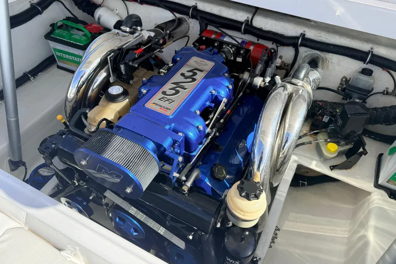 Slide: The Image of Blue high-performance engine for 2007 Donzi 27 ZR boat, displayed in a workshop. - 36