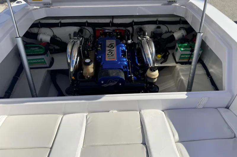 Slide: The Image of 2007 Donzi 27 ZR engine in workshop, featuring blue components and detailed mechanics. - 37