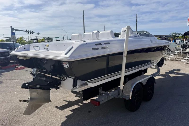Slide: The Image of Rear view of a 2007 Donzi 27 ZR boat showing the engine and propeller setup. - 7