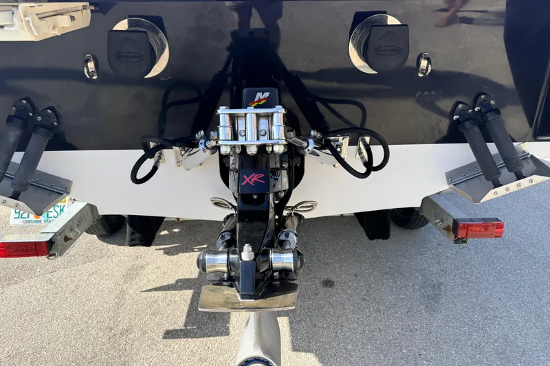 Slide: The Image of Mercury Racing engine on a 2007 Donzi 27 ZR boat, parked outdoors. - 8