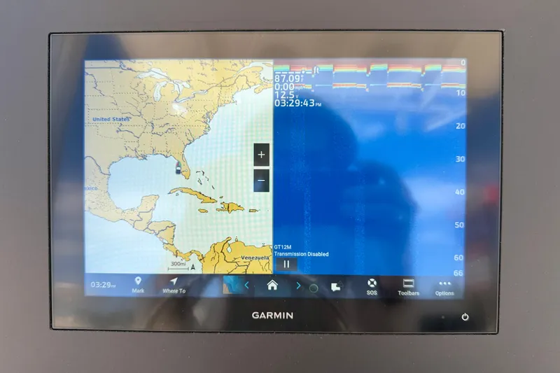 Slide: The Image of Garmin marine GPS display on 2026 Bay Rider 219 Bay boat, showing navigation map and sonar. - 16