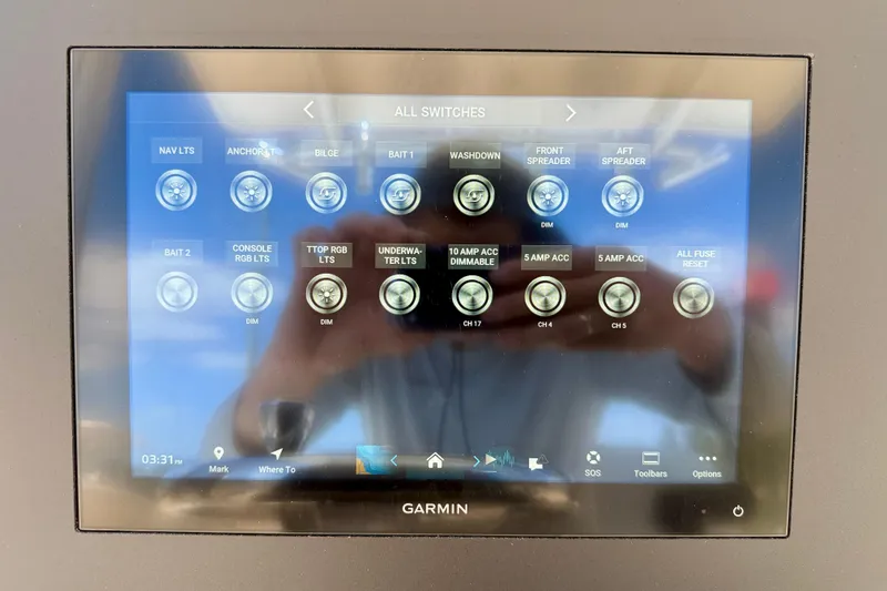 Slide: The Image of Garmin touchscreen control panel on 2026 Bay Rider 219 Bay boat displaying various switch options. - 20