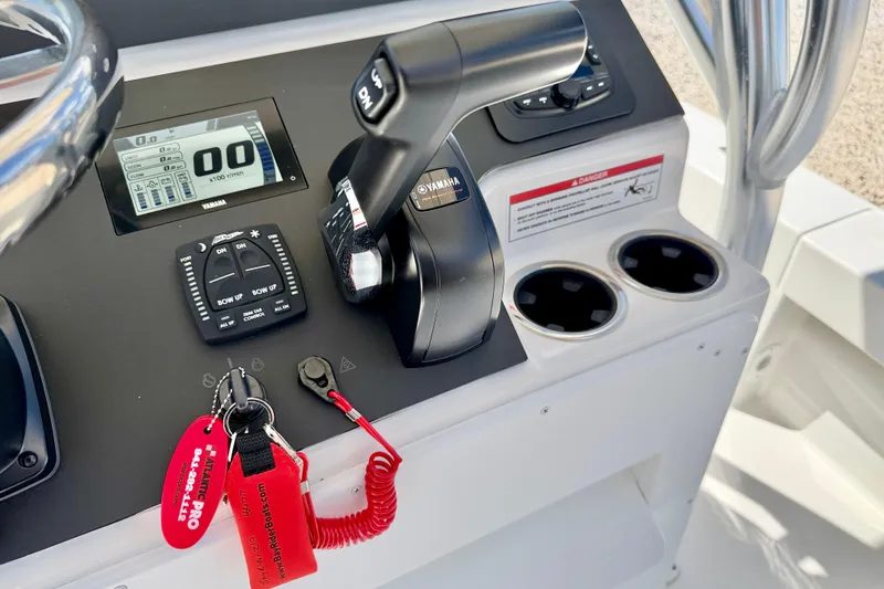 Slide: The Image of Control panel of 2026 Bay Rider 219 Bay boat with Yamaha throttle and digital display. - 22