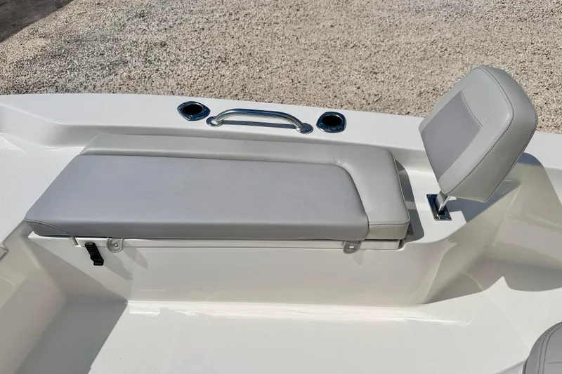 Slide: The Image of 2026 Bay Rider 219 Bay boat seat with gray upholstery and cup holders. - 26