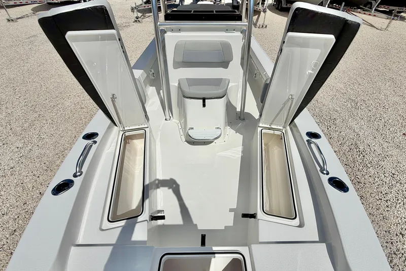 Slide: The Image of 2026 Bay Rider 219 Bay boat interior with open storage compartments and seating. - 29