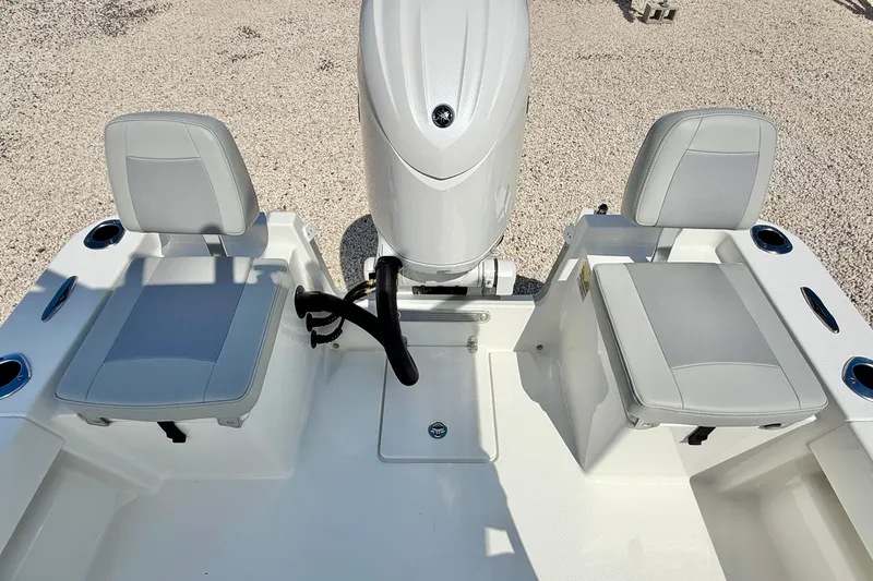 Slide: The Image of 2026 Bay Rider 219 Bay boat interior with dual seats and motor. - 30