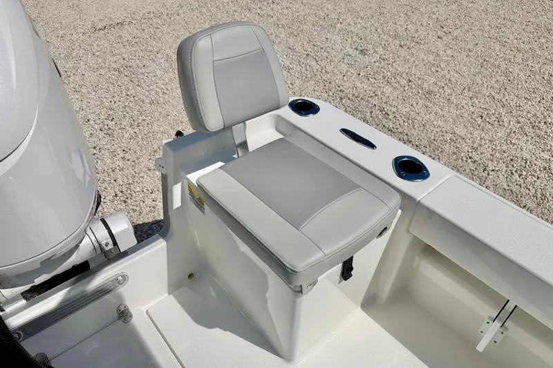 Slide: The Image of 2026 Bay Rider 219 Bay boat seat with cup holders and engine detail. - 31
