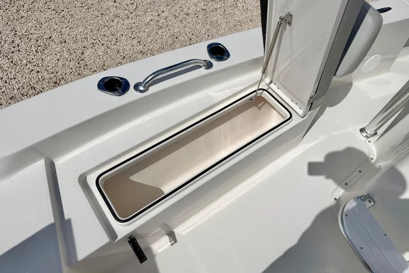 Slide: The Image of Open storage compartment on 2026 Bay Rider 219 Bay boat deck. - 42