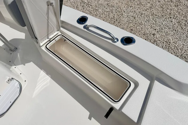 Slide: The Image of 2026 Bay Rider 219 Bay boat storage compartment with open lid, showcasing sleek design and functionality. - 43